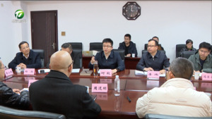 何毅与周道明一行举行工作会谈
